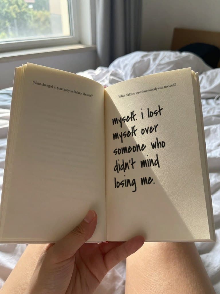the journal held open in a sunlit bedroom, a page answered in black marker